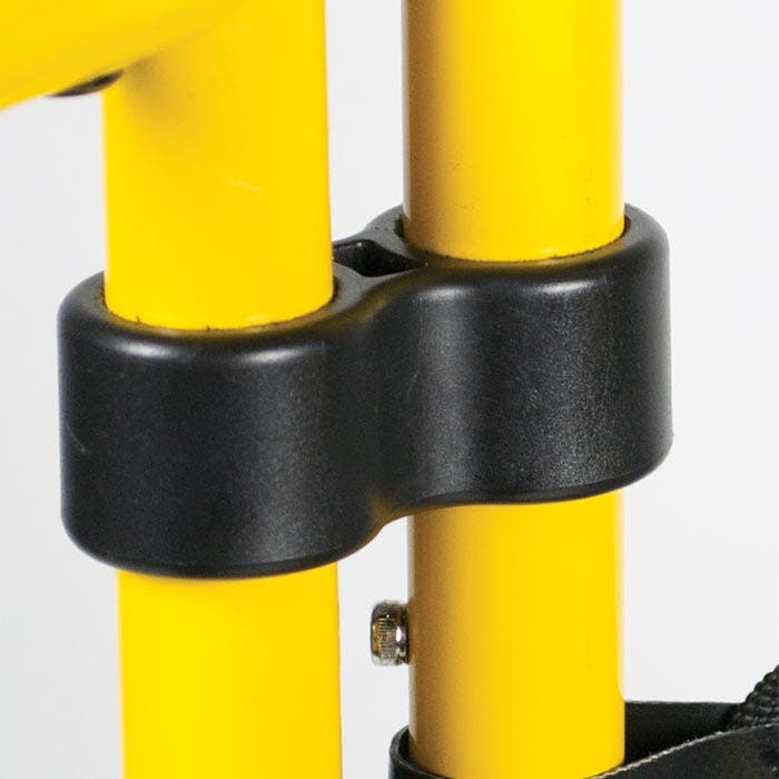 Tri-Guard connecting ring, black, attached to two yellow metal rods, with visible screw and part of a black strap