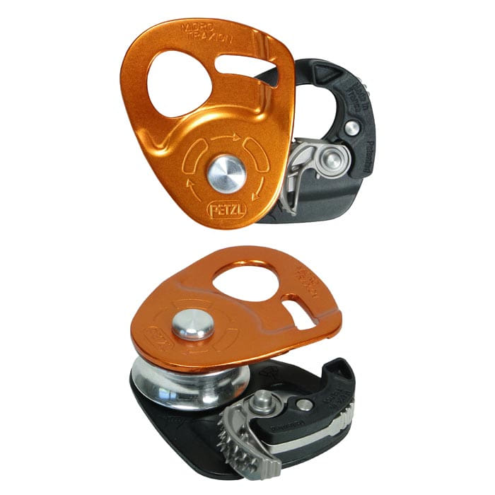 Micro Traxion, two orange and black pulleys with metal wheel and lever mechanism, one lying, one standing, with visible PETZL logo on the orange part