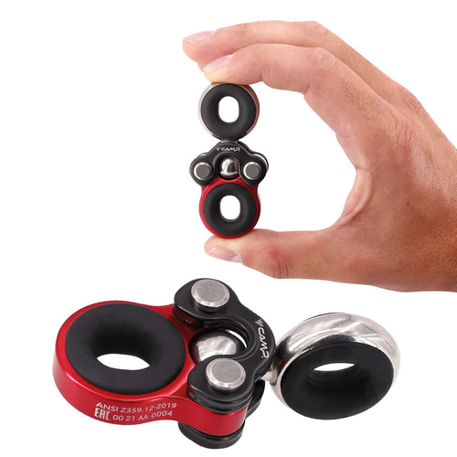 Gyro 1 by CAMP, one hand holds a small red and black metal part with silver rings, underneath lies a larger similar part