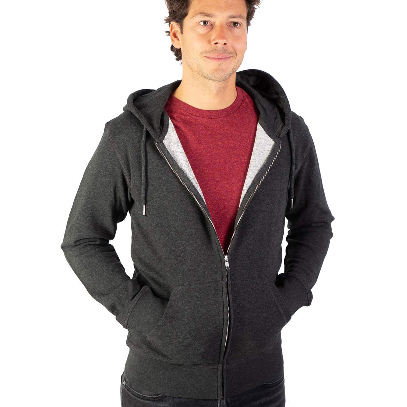 Dark gray Birch Tree Zipp hoodie from the front with open zipper, hood and two pockets, worn by a man with a red t-shirt underneath