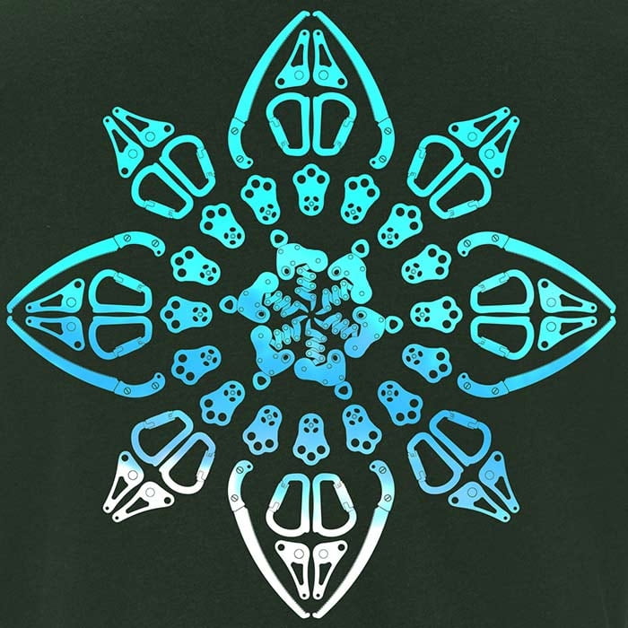 Close-up of blue symmetrical pattern on dark green fabric of Symmetree T-shirt