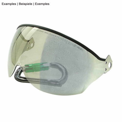 Transparent visor with black edge, partially studded, with green snap hook in the background