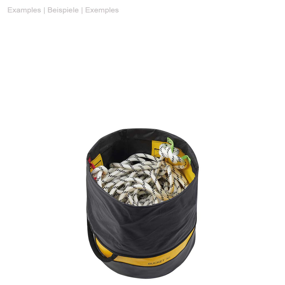 Opened black and yellow PETZL bucket 30 container with white rope inside