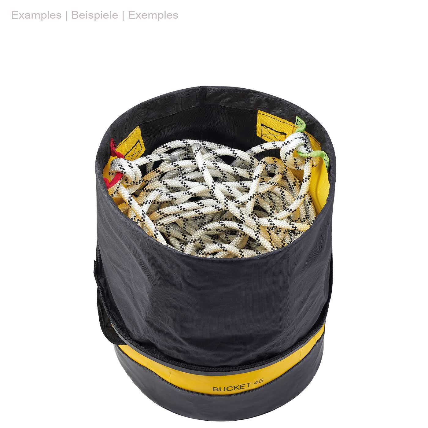 Round yellow and black Petzl Bucket 45 with open black cord closure at the top, filled with a white climbing rope with black dots