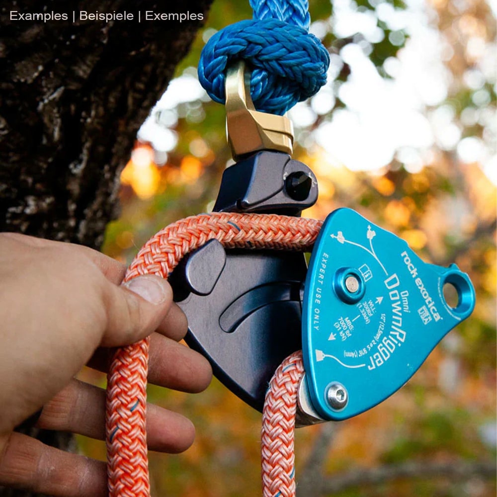 Rock Exotica Omni DownRigger in blue with orange rope, one hand holds the rope, manufacturer Rock Exotica, type DownRigger