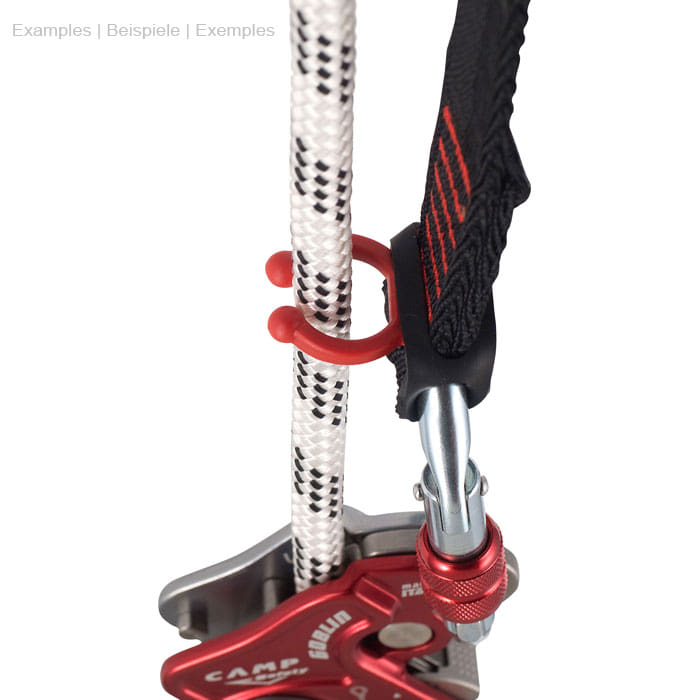 Goblin Rope Surfer, red plastic clip attached to a white rope next to a metal device with red lever and black strap