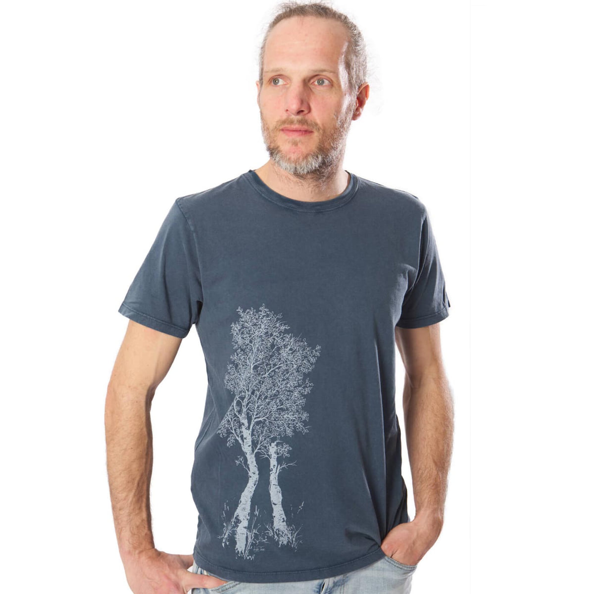 Man wearing a dark blue Birch Tree T-shirt with a white tree motif on the left front