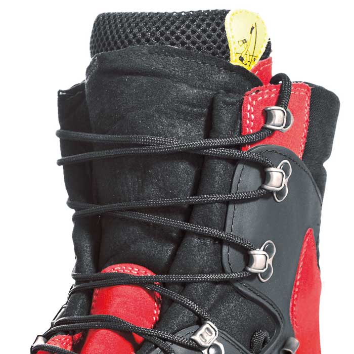 Close-up of the upper part of the red and black Zermatt GTX mountain boot with black laces, metal eyelets and yellow logo on the tongue