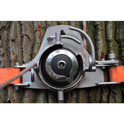 SmartWinch winch mounted on a tree with red rope and orange ratchet strap