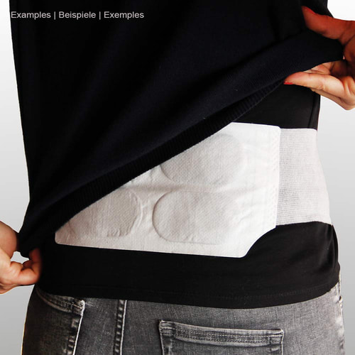 Person wearing the white thermopad heat belt under black top, the belt is placed around the waist and is made visible by pulling up the top