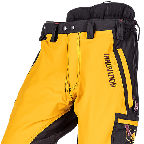 Close-up of Canopy AIR-GO work pants in yellow and black with INNOVATION lettering and zippered pocket