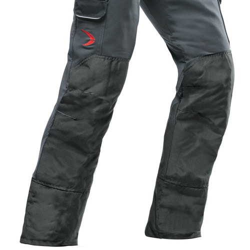 Close-up of the Arborist cut-resistant pants in gray and black, focus on the reinforced knee areas and pockets