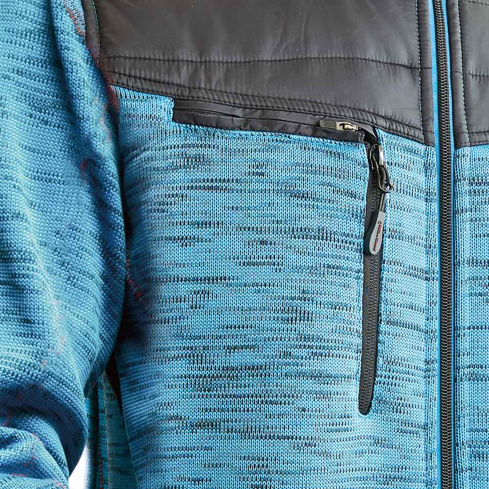 Close-up of light blue Inuit winter jacket with zipper on chest pocket