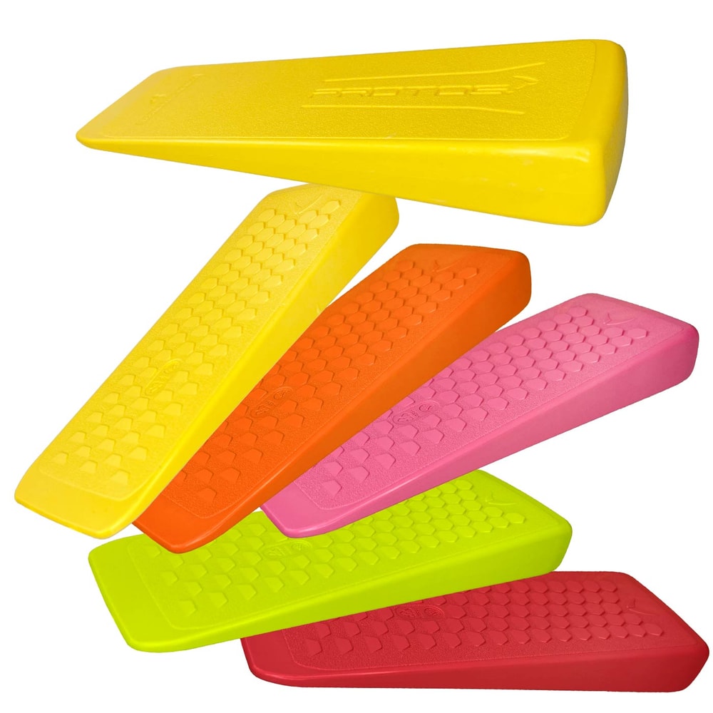 PROTOS® felling wedges in different colours yellow, orange, pink, green and red lie on top of each other, all with a hexagonal structure on the surface