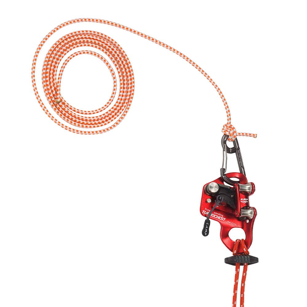 Close-up of red metal device with orange and white rope and carabiner, product name Turboknee System visible