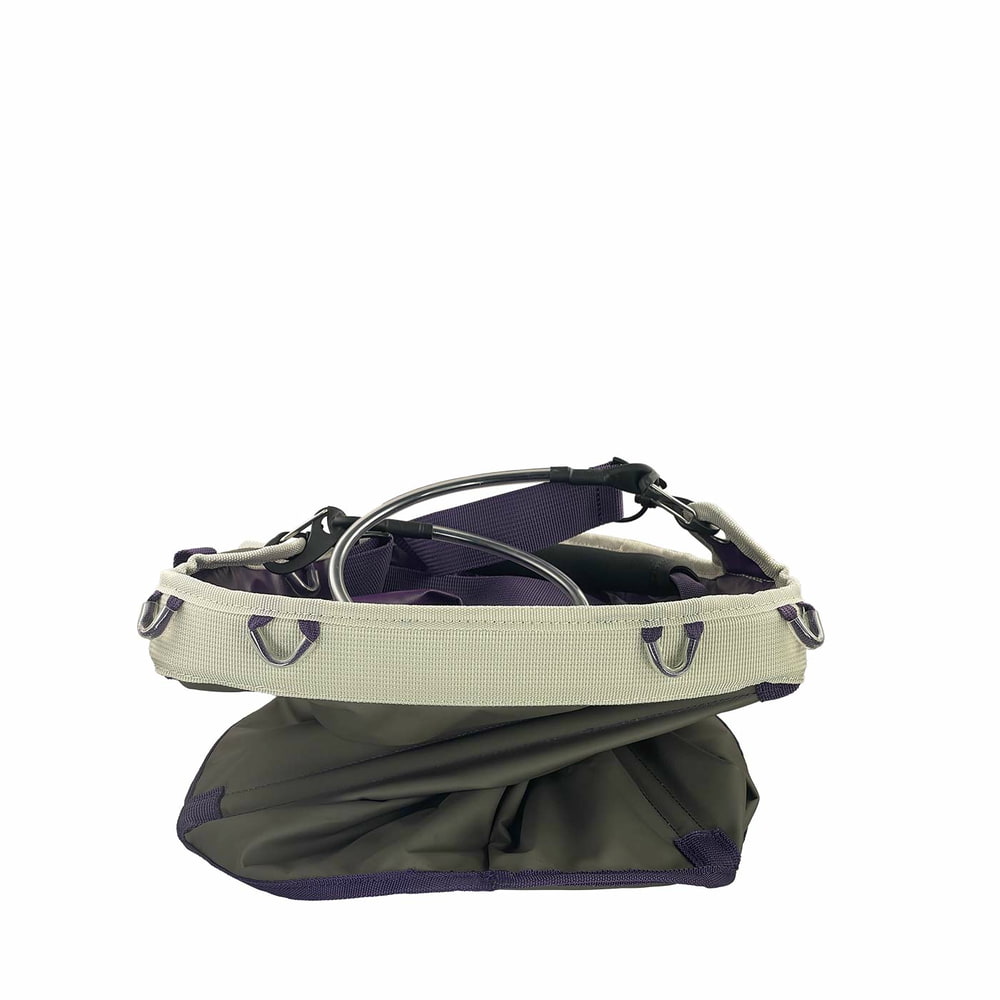 Genius Tool Bucket 2, gray bag with purple straps and white border, compressed from the top with visible metal rings on the edge