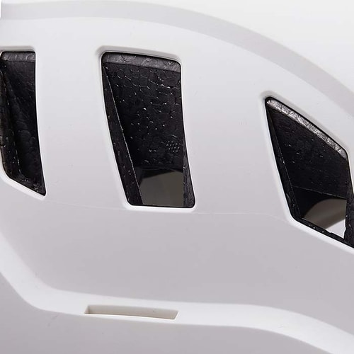Close-up of the vents of a white PETZL Strato Vent helmet
