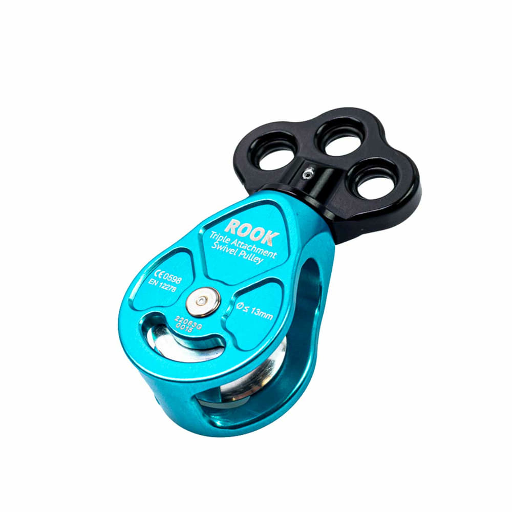 Rook Triple Attachment Swivel Pulley blue pulley with black upper part and three mounting holes, inscription ROOK and technical specifications on the front, photographed lying down