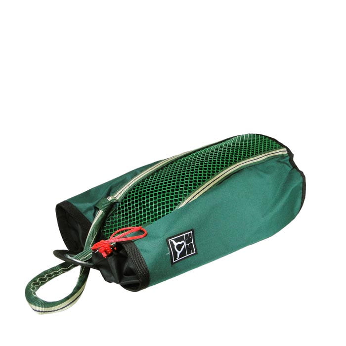 Grab Bag 20, green bag with black edge, mesh compartment on the top, red drawstring and carrying strap, lying