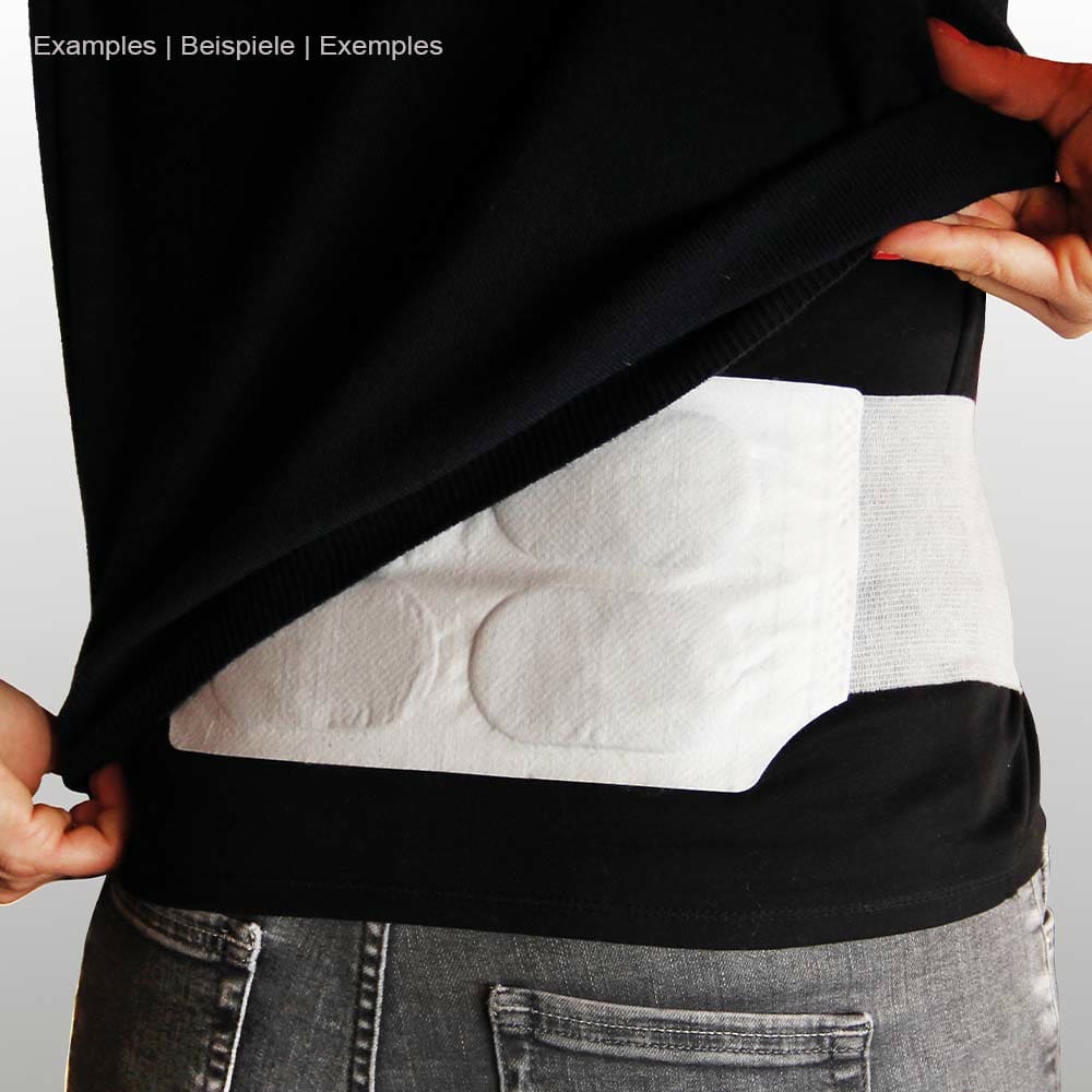 Person wearing the white thermopad heat belt under black top, the belt is placed around the waist and is made visible by pulling up the top