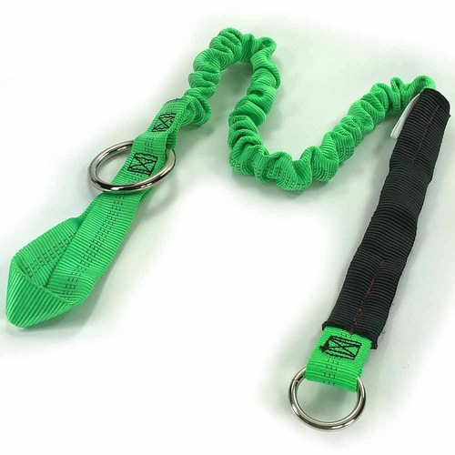 Strop 50, green elastic band with two metal rings, one end with black reinforcement, lying on a white background