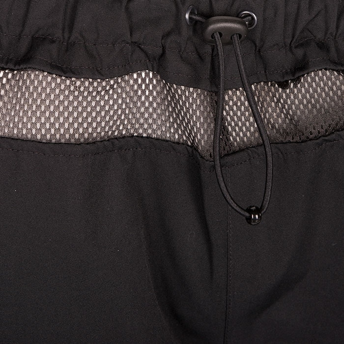 Close-up of the waist area of the Keiu rain pants with elastic waistband and drawstring