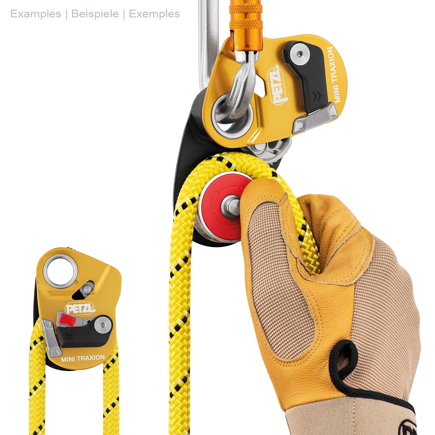 Petzl Mini Traxion Rope Pulley in Yellow and Black with Yellow Rope and Carabiner Held by One Hand with Yellow Work Glove