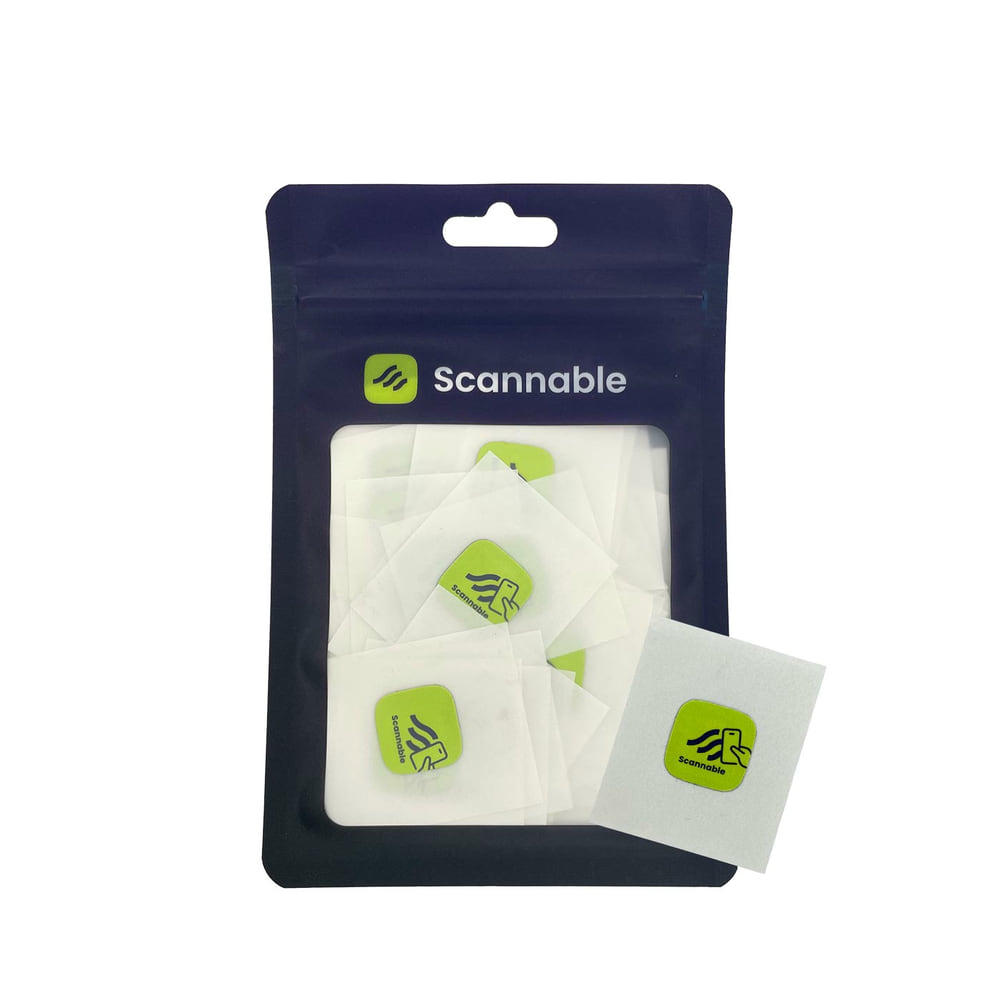 Packaging with several green on-metal stickers NFC tags from Scannable, individual stickers visible in white protective film