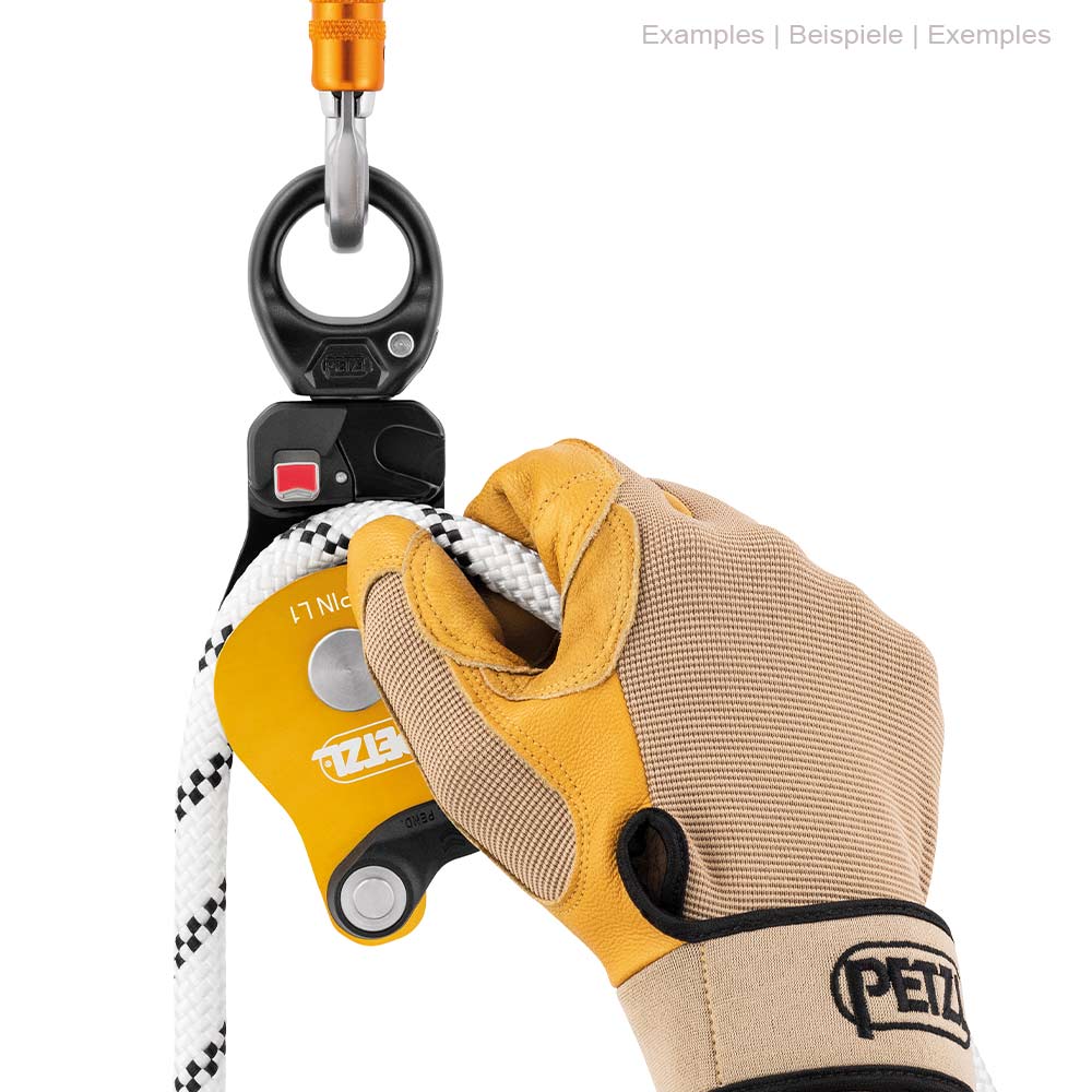 Petzl Spin L1 Rope Pulley with White Rope, held by one hand with work gloves, attached to a carabiner