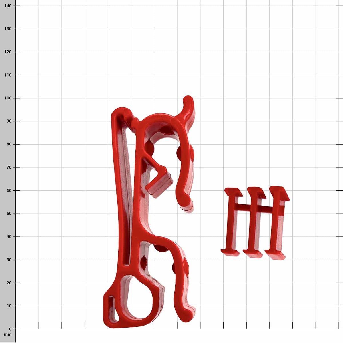 Buddy red plastic clip with three small red plastic pieces on white checkered background