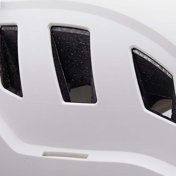 Close-up of the vents of a white PETZL Strato Vent helmet