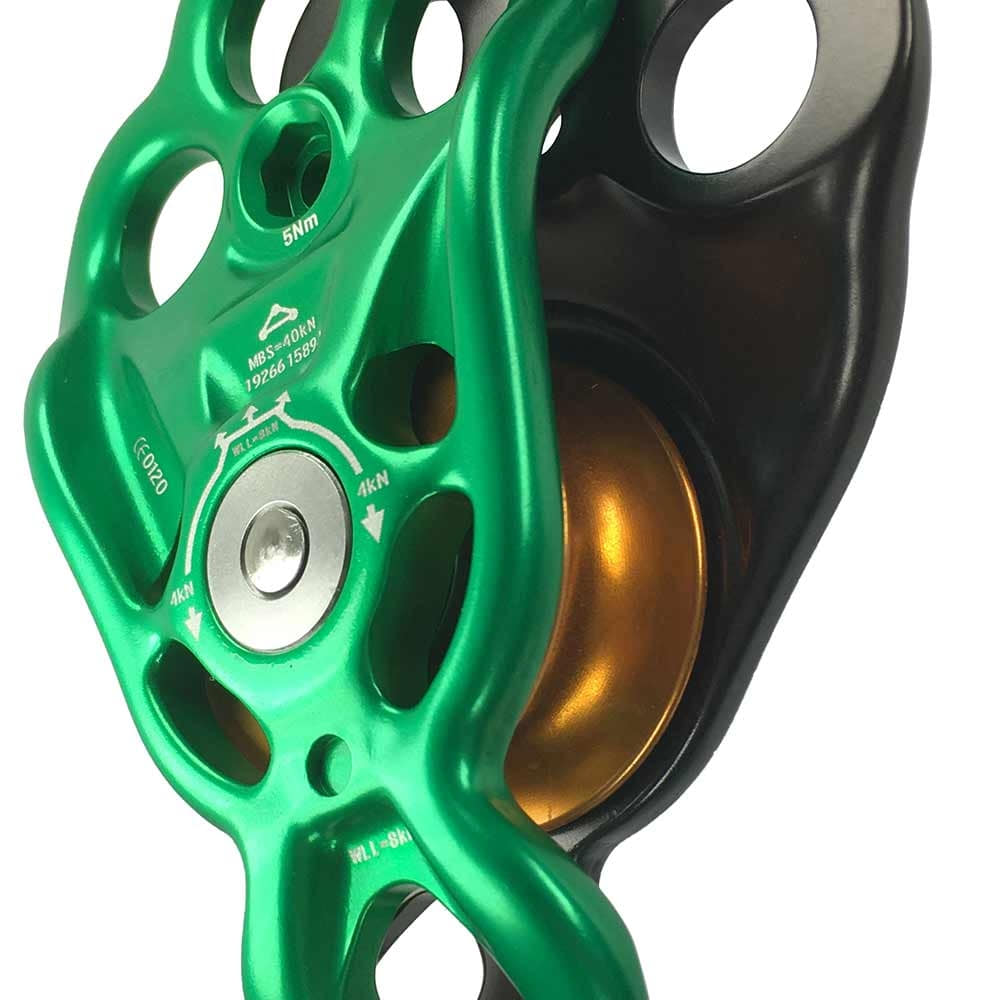 Close-up of the Rigger Becket Pulley green pulley with gold-colored pulley and black parts, product name visible