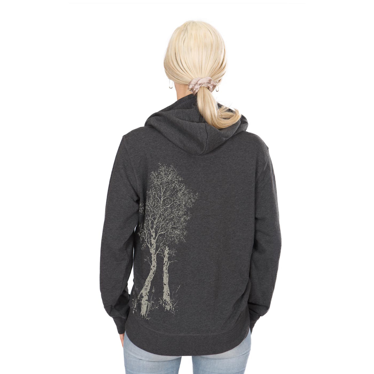 Dark gray Birch Tree Zipp hoodie from the back with hood, on the left side a white birch tree print, worn by a woman with a light ponytail