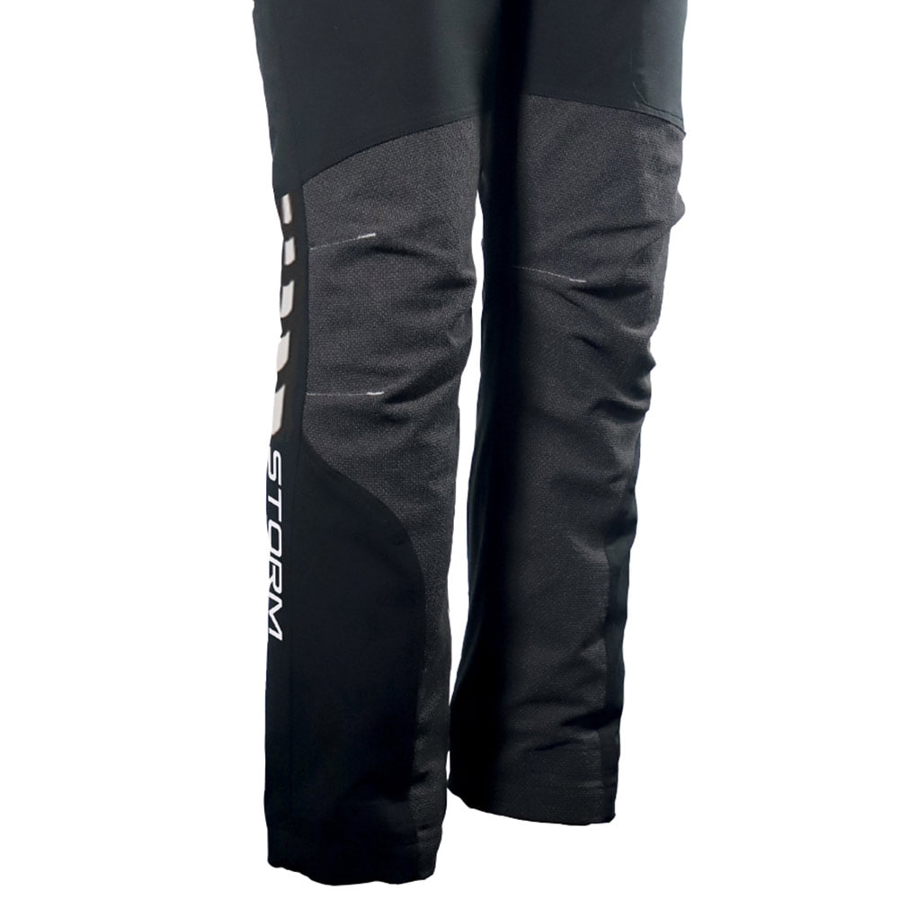 Black Arborflex Skins Storm work trousers with reinforced knees and "Storm" inscription on the side, viewed from below