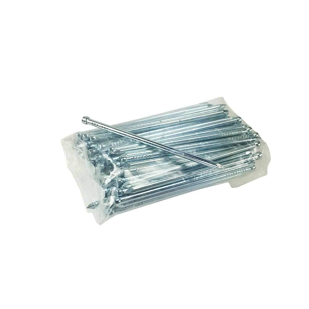 ArboTag nails in transparent plastic packaging, one nail lies loose on it