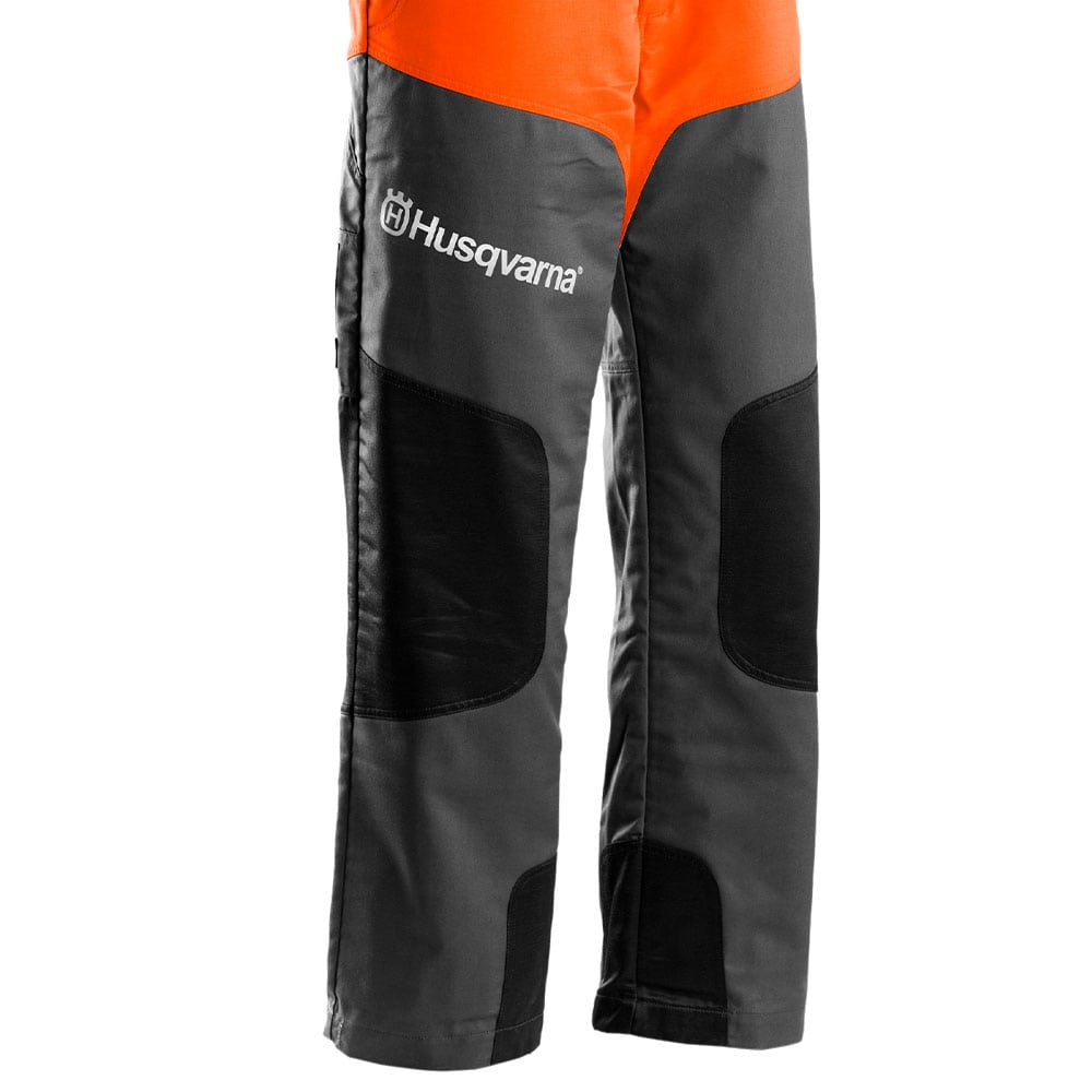 Classic dungarees Detail of grey legs with black knee pads and white Husqvarna logo