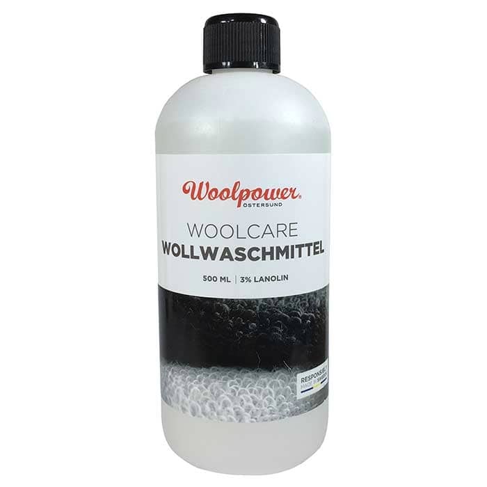 Woolpower Woolcare Wool Detergent 500 ml with black screw cap and white label with black and red text
