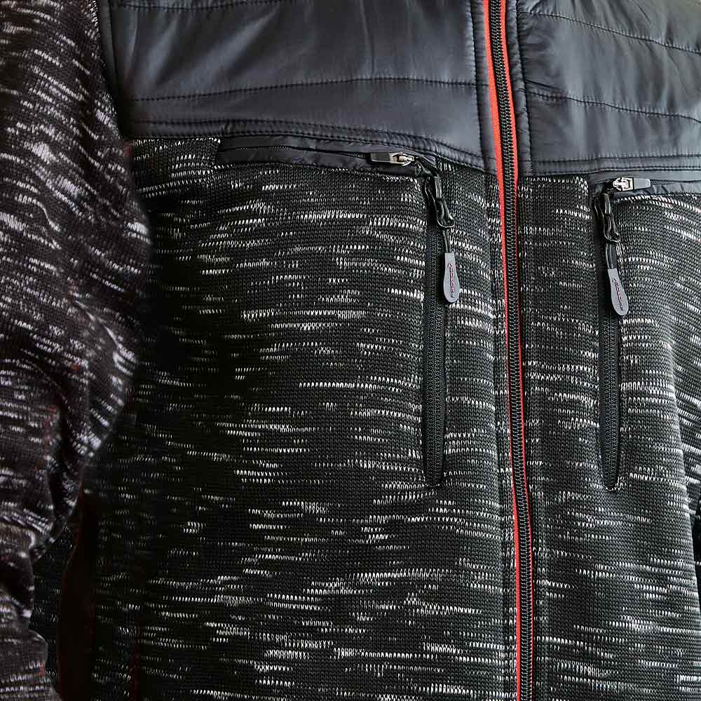 Close-up of black Inuit winter jacket with two vertical chest pockets with zipper