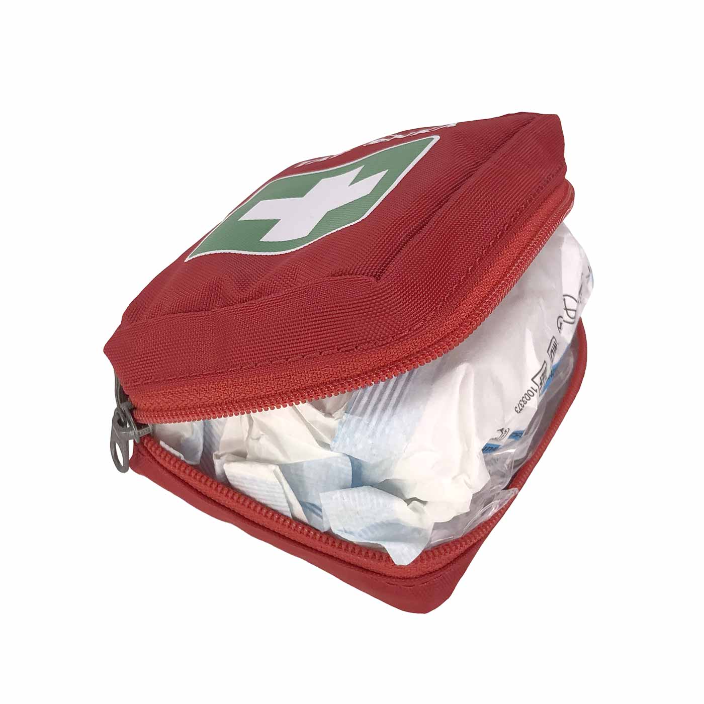 Red Tatonka First Aid XS Set opened, contents visible with white and blue packaging
