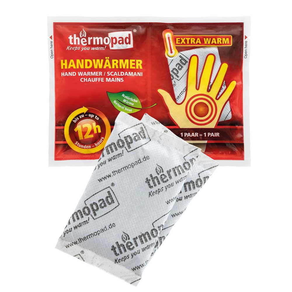 Hand warmer from thermopad in red packaging with yellow hand graphics and a white heat pad with thermopad print in front of it