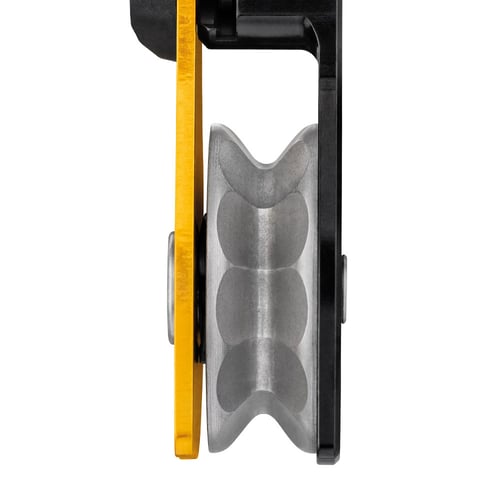Close-up of the Petzl Spin L1D pulley from the side with a visible groove for the rope