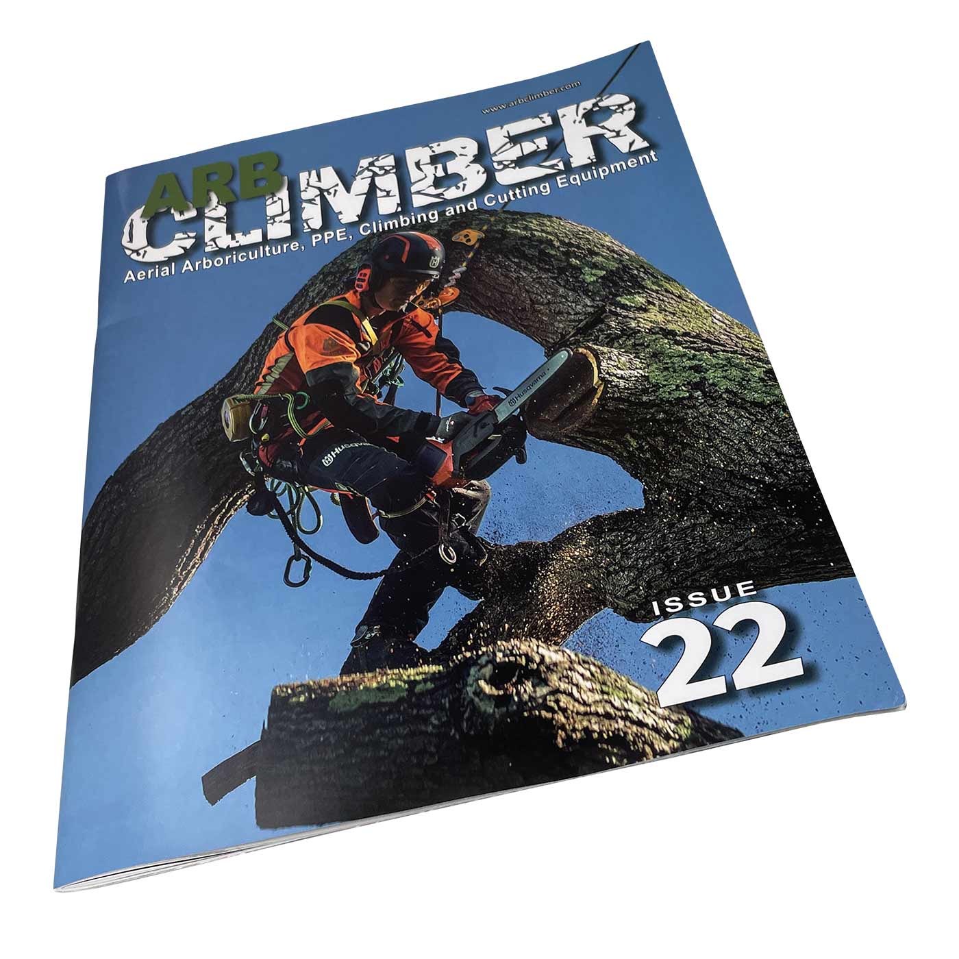 Arb Climber No. 22 magazine with title and image of an arborist using a chainsaw on a tree, blue background, slightly slanted