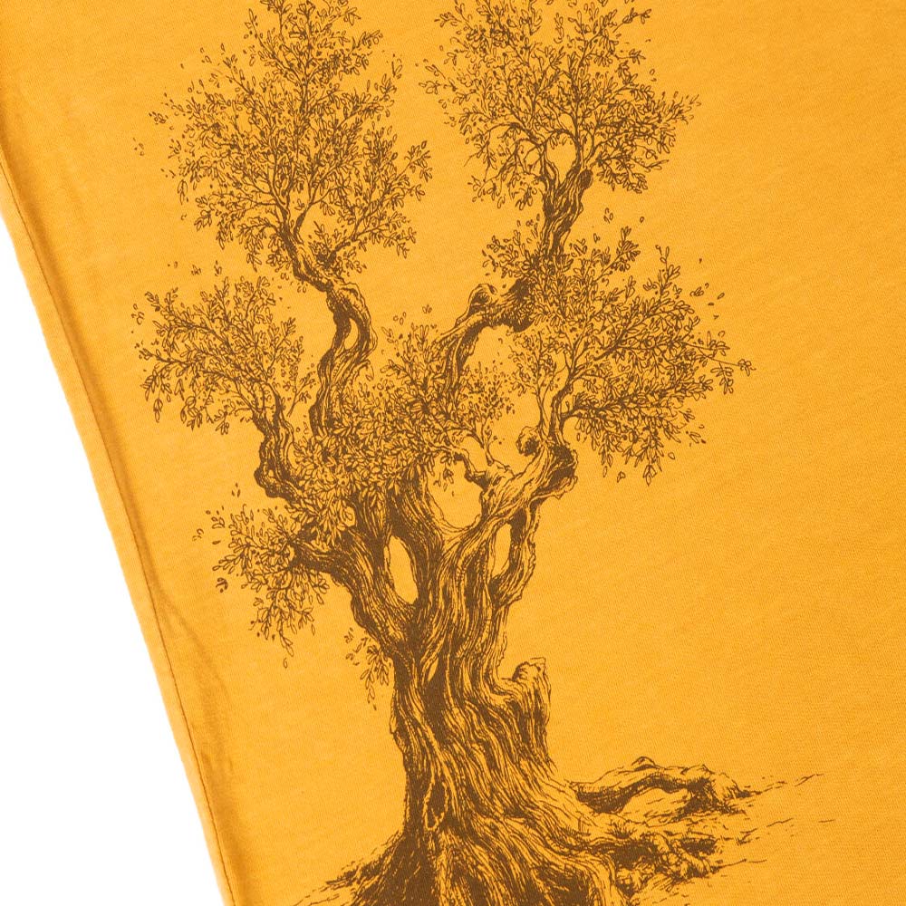 Olive Tree T-shirt, detail shot of brown olive tree print on yellow fabric of t-shirt
