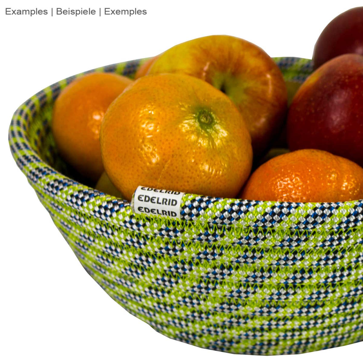 Rope bowl by Edelrid, green bowl made of rope, filled with various fruits, close-up