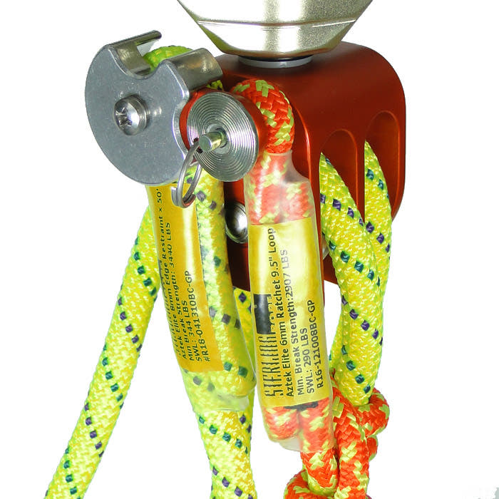 Close-up of the Aztek safety rope by Petzl with yellow and orange rope strands, red metal block and metal locking mechanism