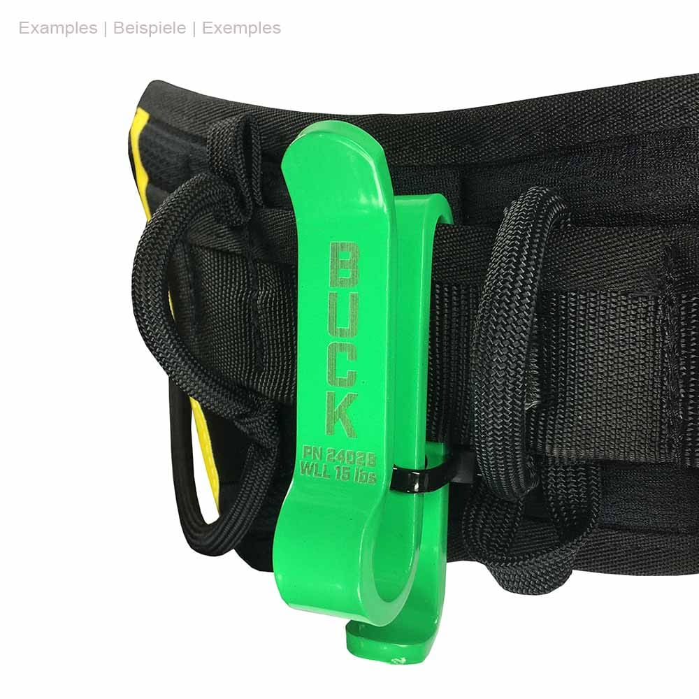 Green plastic BuckCarrier, attached to black belt with loops and black cable tie, "BUCK" lettering visible