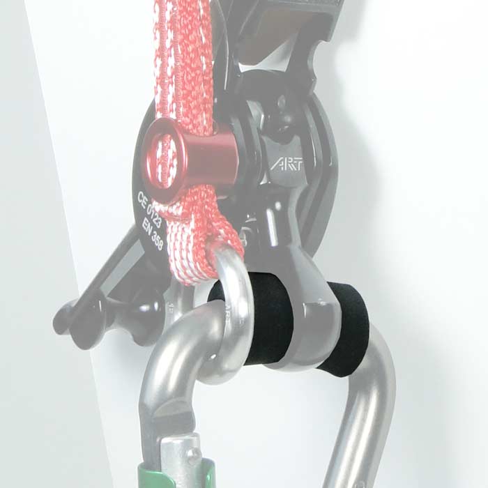 SpiderJack Elastic Fastener, black rubber ring between metal carabiner and rope on a climbing device