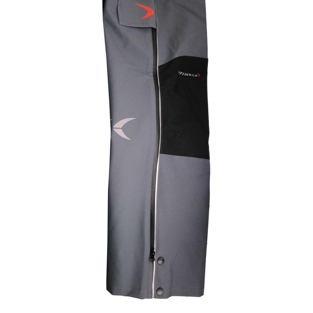 Nanoshield® EVO rain pants in grey with side zipper and buttons on the lower leg, black knee reinforcement and red logo above the pocket