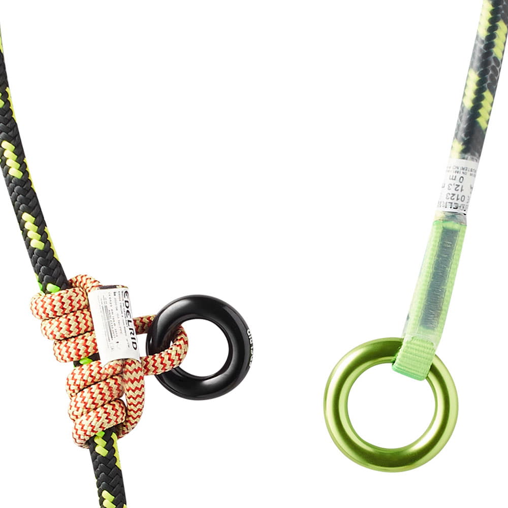Close-up of knot on a black and yellow rope with black metal ring and green metal ring on the other end
