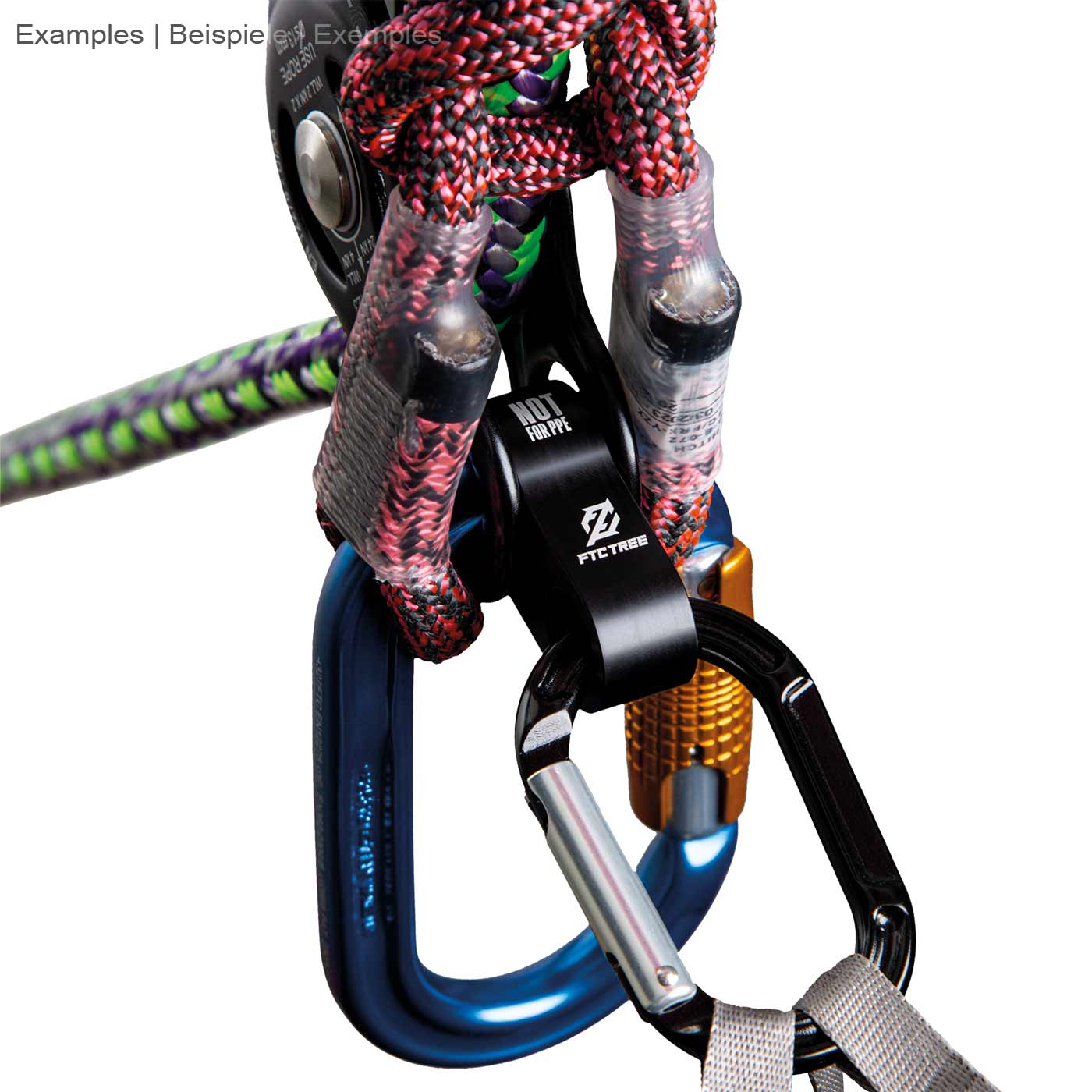 Rise-Up by FTC TREE, black metal part with two round openings, attached to colorful climbing ropes and two carabiners, close-up